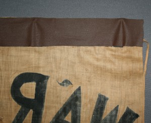Reverse of banner before treatment with detail of tape.