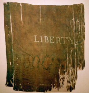 Historic Liberty Flag conserved and mounted by Spicer Art Conservation. Located in upstate New York, we specialize in the preservation of historically significant battle flags, banners, textiles, garments and objects