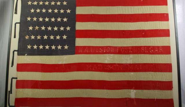 Pressure mount of historically significant American flag by Spicer Art Conservation, experts in the care and preservation of flags, banners, and textiles.