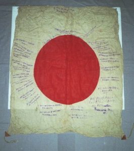 A signed silk Japanese Flag from WWII before it was conserved and mounted by textile conservator and flag restoration expert Gwen Spicer of Spicer Art Conservation located in Upstate New York and serving clients in the United States and abroad with historic flag conservation, restoration, repair and framing and mounting for display and exhibit